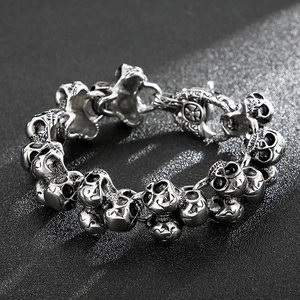 Detailed close-up of Gothic skull bracelet links in vintage stainless steel finish