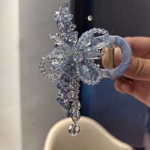 Blue ribbon hair claw with luxury crystal flower pendants and beaded tassel details