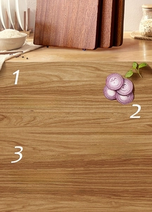Macro detail of natural ebony wood cutting board showing solid wood texture and grain