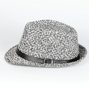 Detail of two-tone woven fedora hat with black leather band and silver buckle