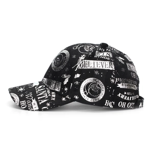 Side view of black Christmas baseball cap featuring white Santa and snowflake prints