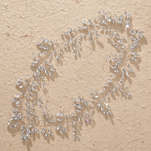 Handcrafted silver bridal headband with sparkling crystals in leaf and vine pattern design