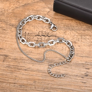 Detail view of silver double-layered stainless steel chain bracelet with lobster clasp
