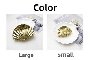 Comparison of large and small golden shell hair claws with polished alloy finish
