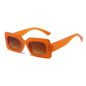 Retro rectangle sunglasses with translucent orange frames and tinted brown lenses