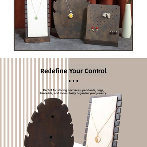 Detailed view of dark walnut wood necklace display board with cream soft padded insert