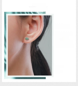 Detail of S925 sterling silver stud earring with lush green micro-set gemstones
