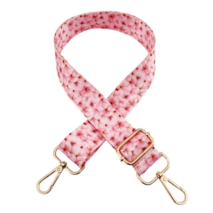 Adjustable wide replacement bag strap with pink cherry blossom pattern and gold clips