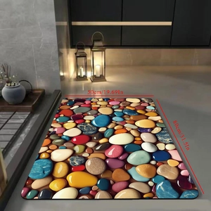Detailed view of pebble pattern bath mat showing 50x80cm dimensions and vibrant colors