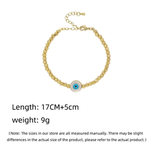 Detailed view of gold beaded evil eye bracelet with size and weight specifications