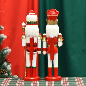 Pair of 38cm wooden nutcracker king figures in festive red and gold holiday costumes