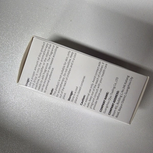 Macro shot of essential oil packaging box showing usage instructions and caution text