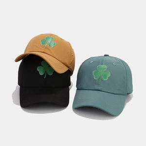 Three shamrock print baseball caps in black, khaki and blue with breathable dry fabric