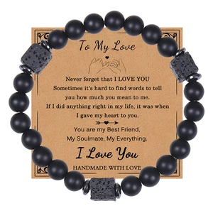 Matte onyx beaded bracelet with lava stone detail displayed on a kraft gift card