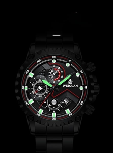 Close-up of matte black sports watch with luminous green hands and chronograph dials