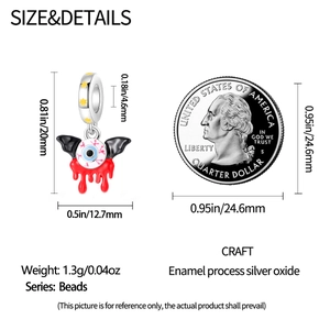 Detailed view of silver eyeball charm dimensions with enamel drip effect and gothic style