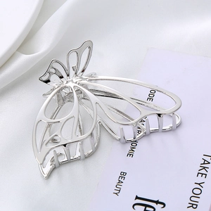 Silver butterfly hair claw clip with elegant hollow metal design and polished finish