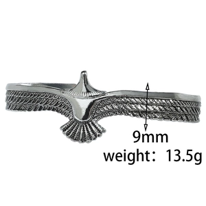 Detail view of vintage eagle feather cuff bangle with 9mm width and 13.5g weight info