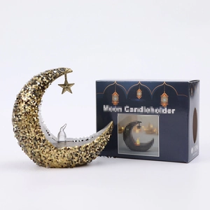 Star and moon candle holder in antique gold with elegant deep blue packaging box