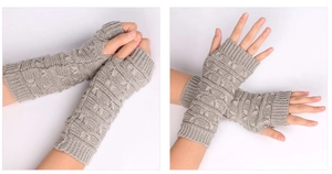 Close-up of light grey cable knit fingerless gloves with 3D embossed pattern details