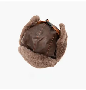 Top view of dark brown PU leather aviator hat with thick grey faux fur lining and buckle