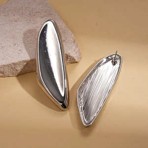 Minimalist silver irregular geometric drop earrings with polished and textured metal finish