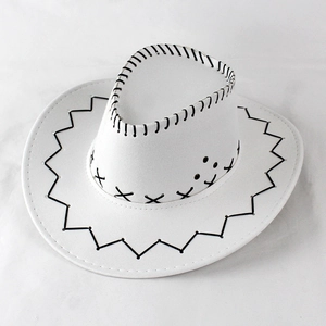 Close-up of white felt cowboy hat featuring black contrast stitching and western brim detail