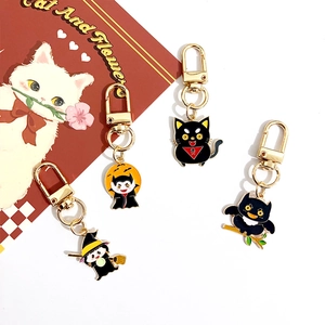 Cartoon Halloween enamel keychains with witch, vampire, black cat and owl motifs