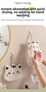 Detail of cute cat-shaped coral fleece hand towel with fine embroidery and hanging loop