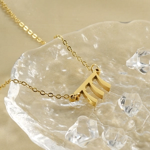 Golden stainless steel necklace featuring a mathematical Pi pendant on textured glass