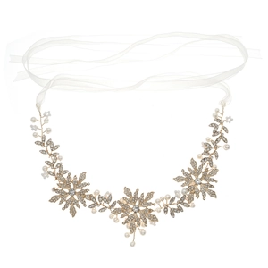 Exquisite gold bridal headband with rhinestones and white ribbons on white background