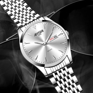 Detailed macro view of the silver sunray watch dial showing double calendar and date windows