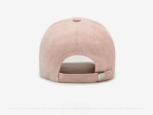 Detail of pink herringbone baseball cap back view with adjustable silver metal buckle