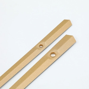 Matte gold aluminum metal clock hands with central hole and pointed tip for quartz movements