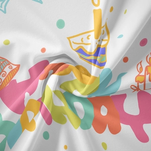 Macro detail of Happy Birthday tapestry showing soft fabric texture and colorful patterns