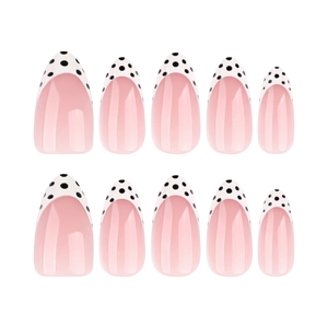 Short almond press-on nails with white French tips and black polka dot accents