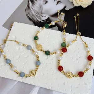 Three-piece 18k gold plated beaded bracelet set with colorful beads and virgin mary charms