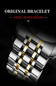 Detail of luxury two-tone seven-beads steel watch bracelet with polished gold and silver links