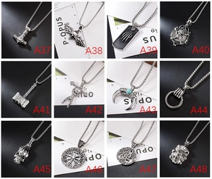 Collage of twelve vintage silver gothic pendants with skulls and Viking compass designs