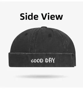 Side view of black washed cotton brimless docker cap with GOOD DAY white embroidery