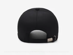 Adjustable back strap of black cotton baseball cap with silver metal buckle closure