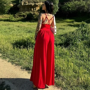Back view of a vibrant red backless halter wide-leg jumpsuit for a summer fashion look