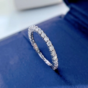 Macro shot of silver S925 sterling silver ring with delicate pave-set diamonds