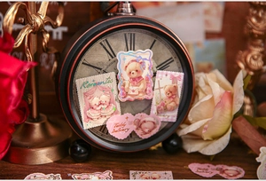 Detail of vintage teddy bear stamp stickers with romantic heart and floral patterns