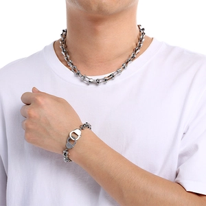Titanium steel punk necklace and handcuff bracelet set in silver finish on model