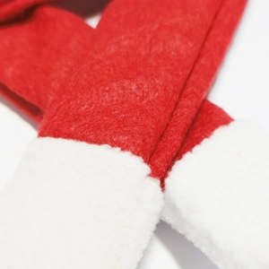 Detailed close-up of red and white striped felt Christmas scarf for bottle decoration