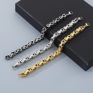 Detailed weave of Byzantine king chains in gold, silver, and black steel tones