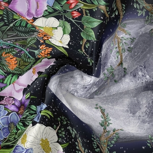 Close-up of high-definition moon phase and floral prints on smooth decorative fabric