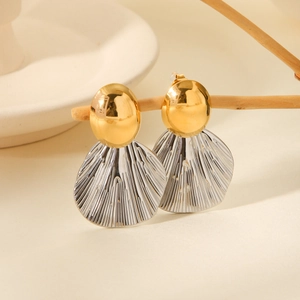 Two-tone gold and silver pleated fan earrings with metallic dome stud on wood branch