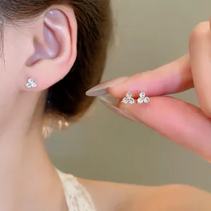 Three-stone clover flower stud earrings with gold base and clear zircon crystals